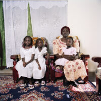 Image: Lee Grant, [Mary with her daughters Aja and Adau, and her granddaughter Nankir], 2009, from the series [New Australians: Sudanese migrants in suburbia], Monash Gallery of Art, City of Monash Collection.
Courtesy of the artist