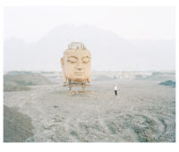 Image: Zhang Kechun,[煤场里的佛像], from the series [Yellow River]. Courtesy the artist
